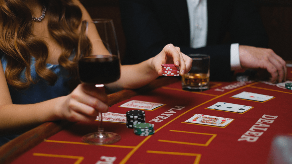 Elegant man and woman playing poker