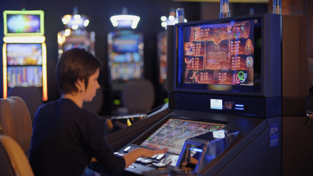 A man playing slot machine in Casino