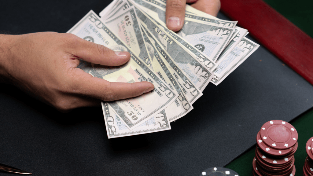 man counting banknotes