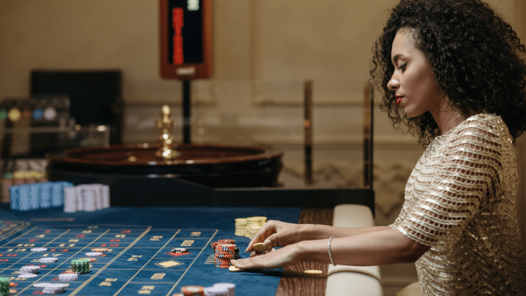 Woman betting on roulette table