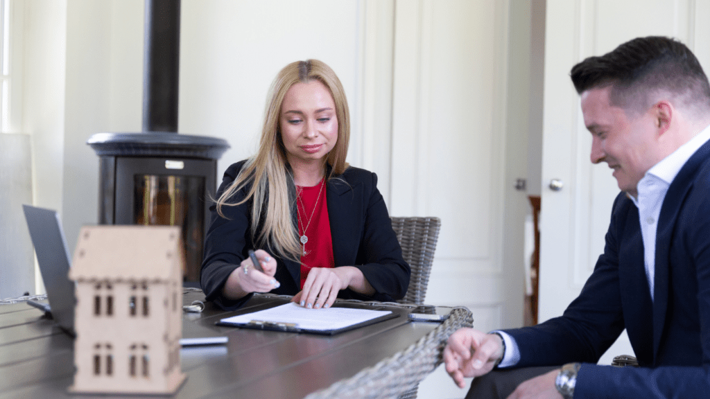 man and woman discussing legal papers