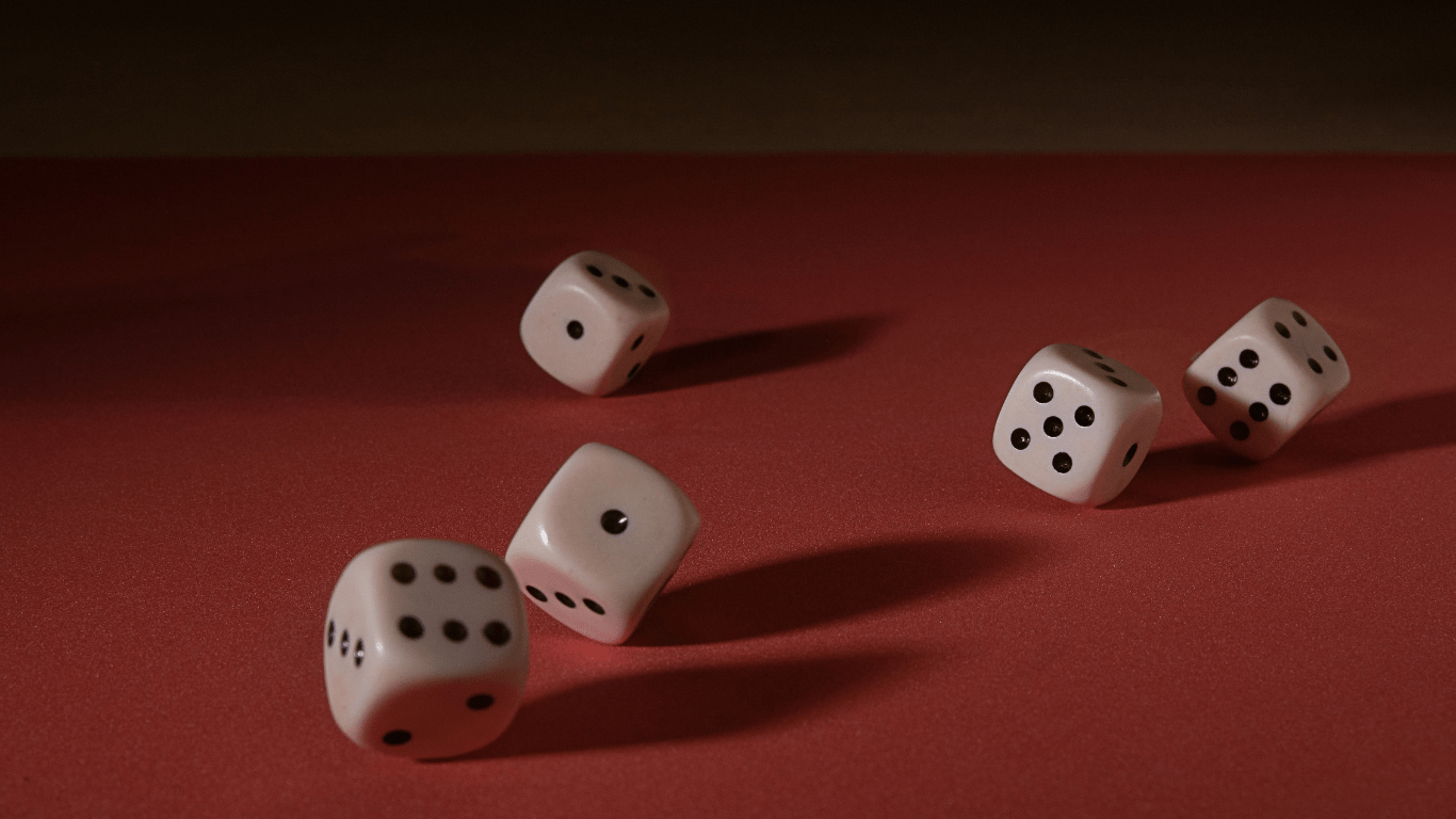 set of dice in a red surface