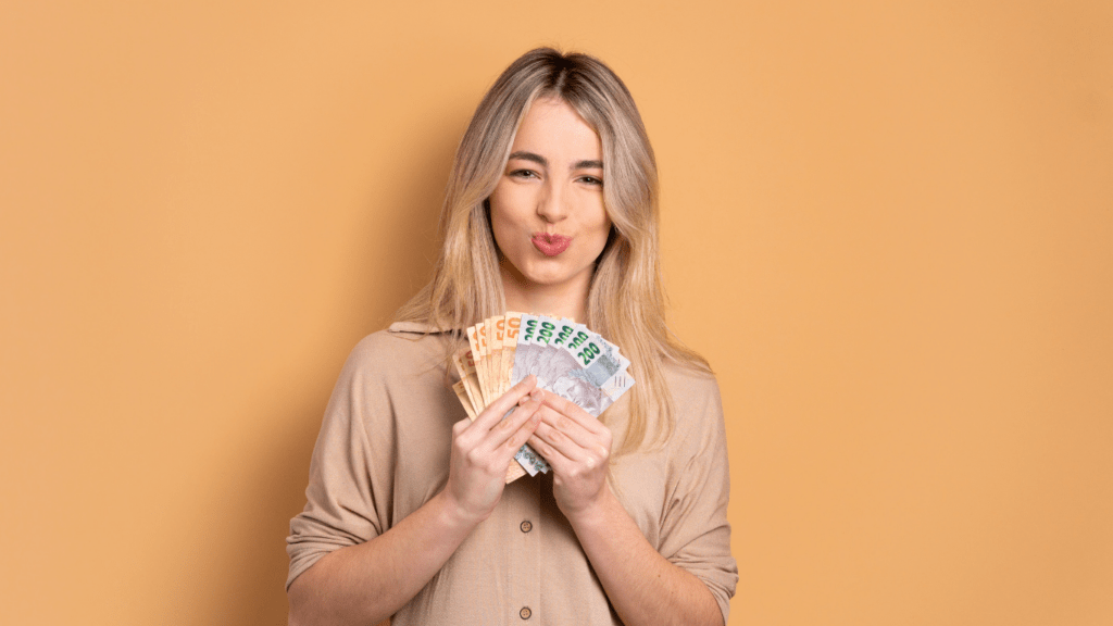 woman holding banknotes